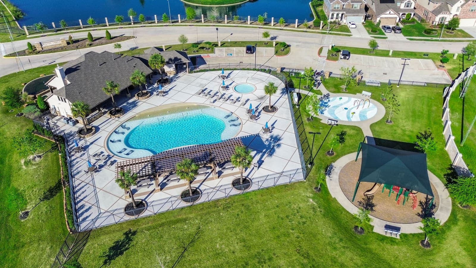 Lexma drone aerial photography — community pool and lake