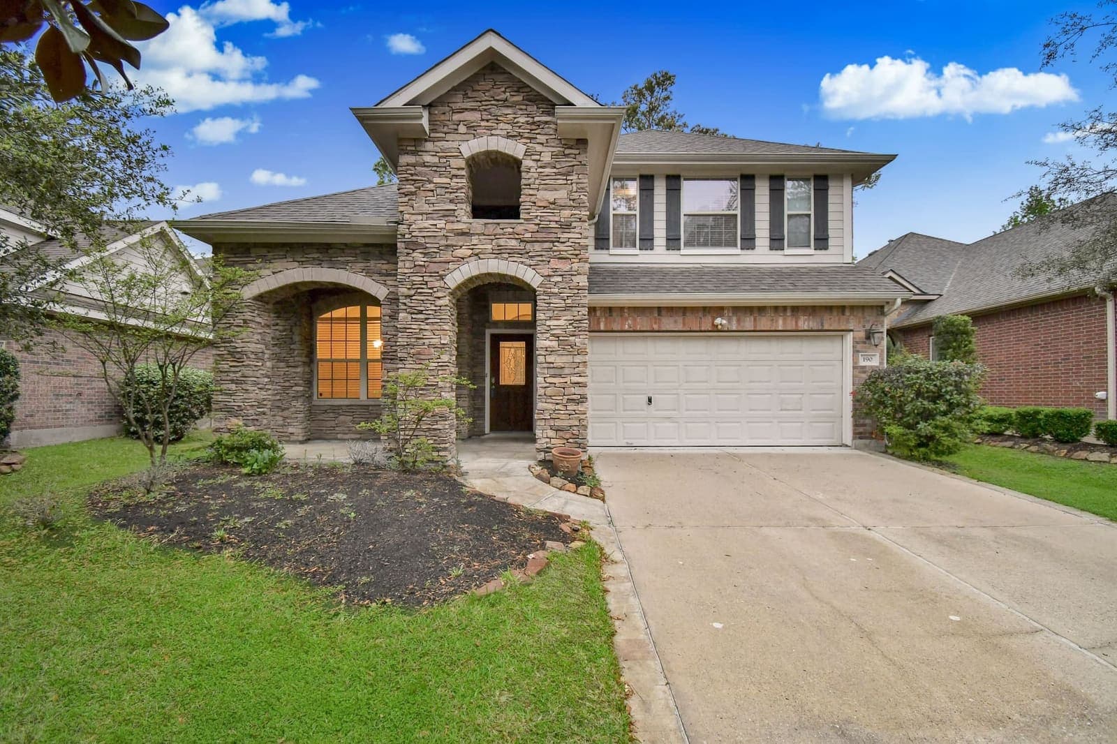 Lexma real estate photography — stone facade Houston home